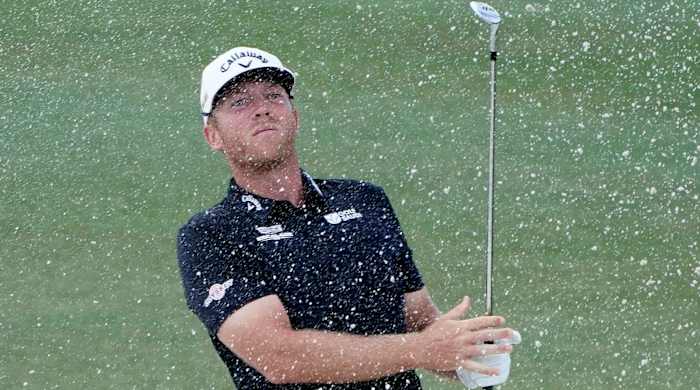 Talor Gooch hits out of a bunker at the 2022 LIV Golf Miami Team Championship.